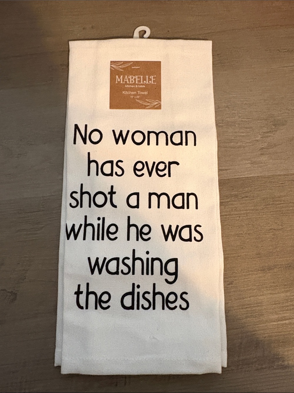 Cream Kitchen Towel with Black Text - 'No woman has ever...'